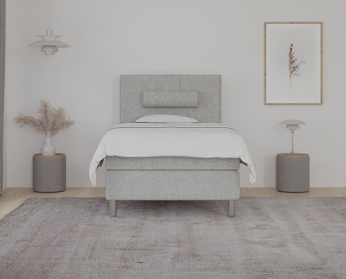 Senge af moderne design med blødt, gråt stof og elegant hovedgavl, perfekt til komfortabel søvn og stilfuldt hjemindretning.